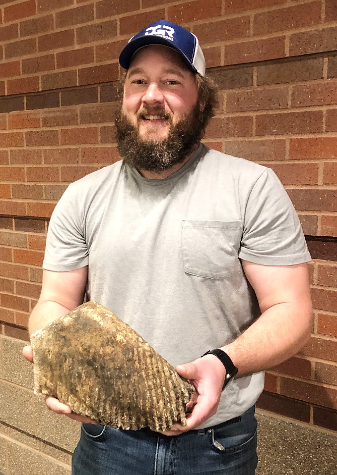 Justin Blauwet of Rock Rapids holds the Mammoth molar